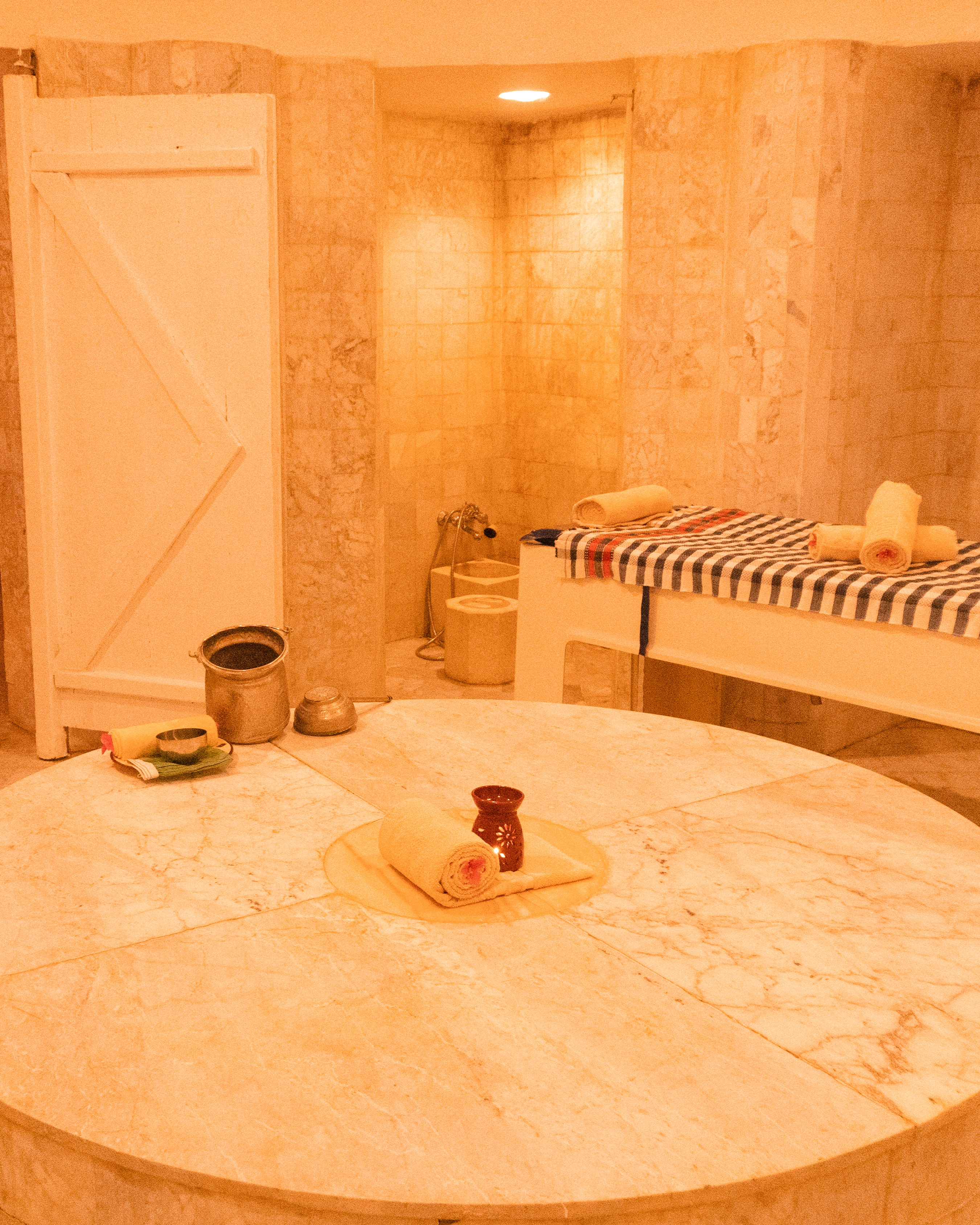 Sand Spa interior with marble surfaces and warm lighting